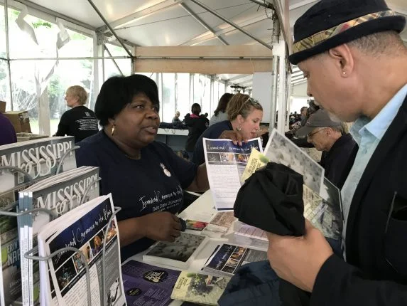 Delta Center team members Shelia Winters and Sarah Hicks distributing information about the International Conference on the Blues and other MDNHA events and attractions.