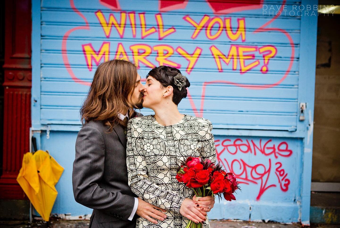 When your flowers and umbrella match the relevant street art. Not planned. One of the best things about wedding photography in NYC. You never know what you&rsquo;re going to find. Just the best. #nycelopement #weddinginspiration #streetwedding #micro