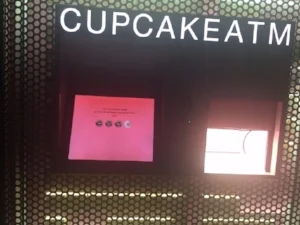 This here is a cupcake ATM. Yes, this really exists. In New York City and Los Angeles, you can find the Sprinkles Cupcake ATM. You go up to it, pick your flavors, pay and POP! Comes out the cupcake! You can find it here: 780 Lexington Ave, New York, NY 10065