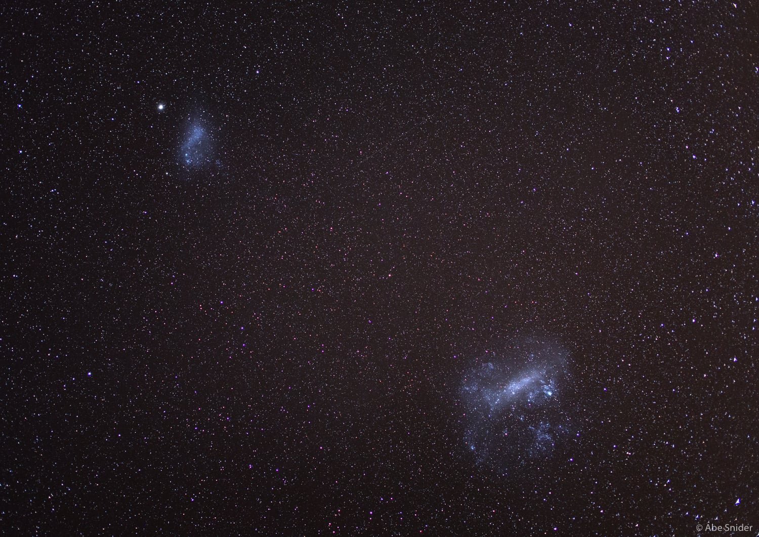 The Large and Small Magellanic clouds as seen from Lake Tekapo, New Zealand. 
