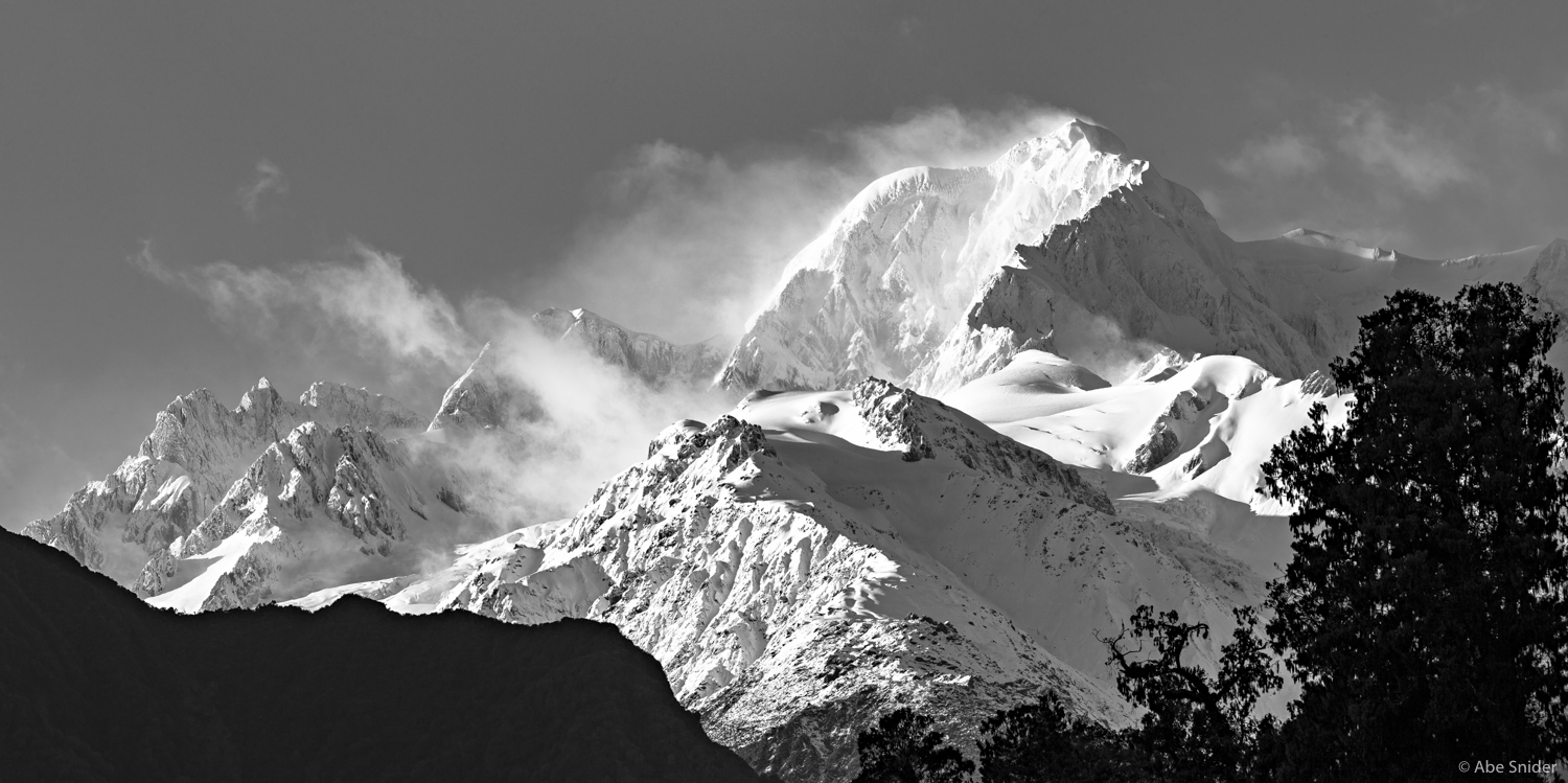 Mount Tasman on a cold clear morning seen from Lake Matheson, New Zealand. 