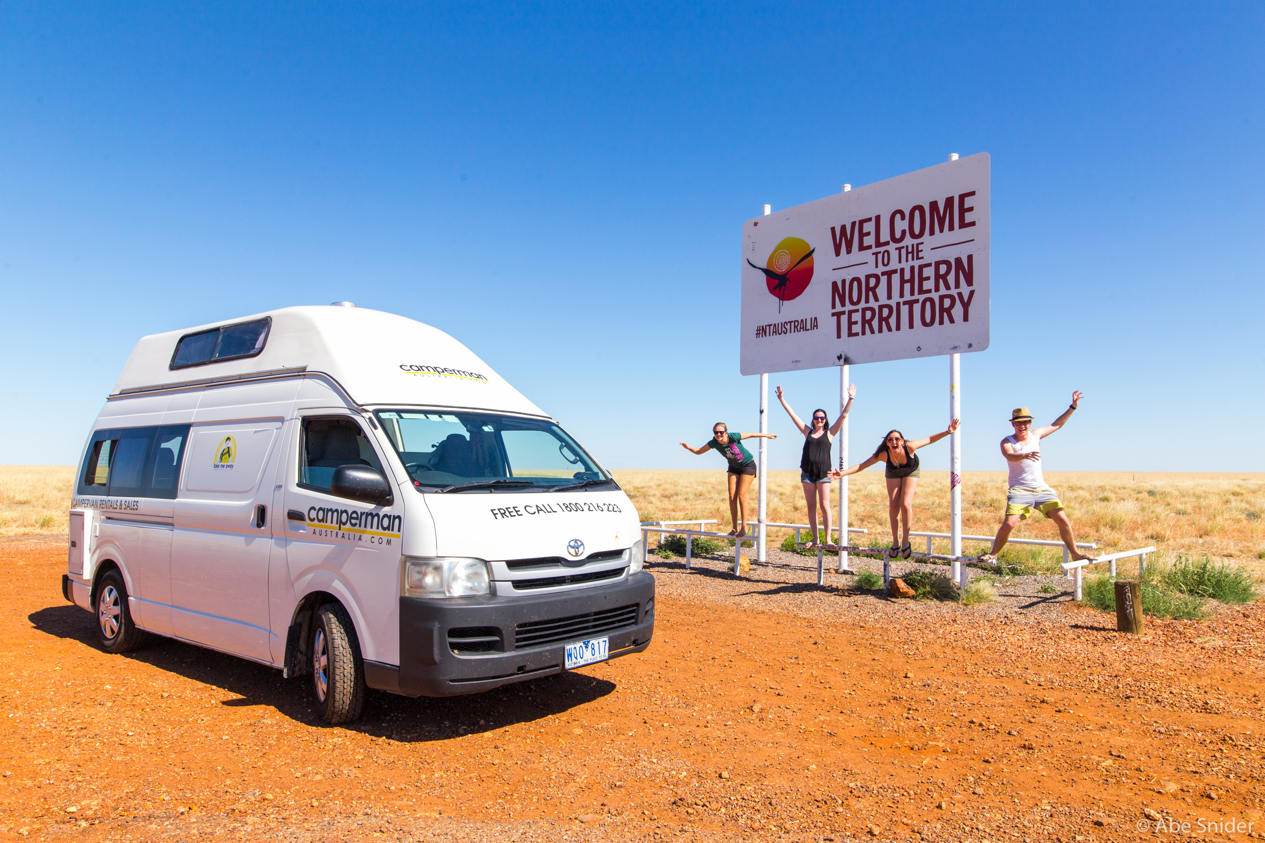 "Roo" our van, and the four of us on the way to Uluru! I won't admit how many times we had to try to get this photo, we all kept falling off the railing!