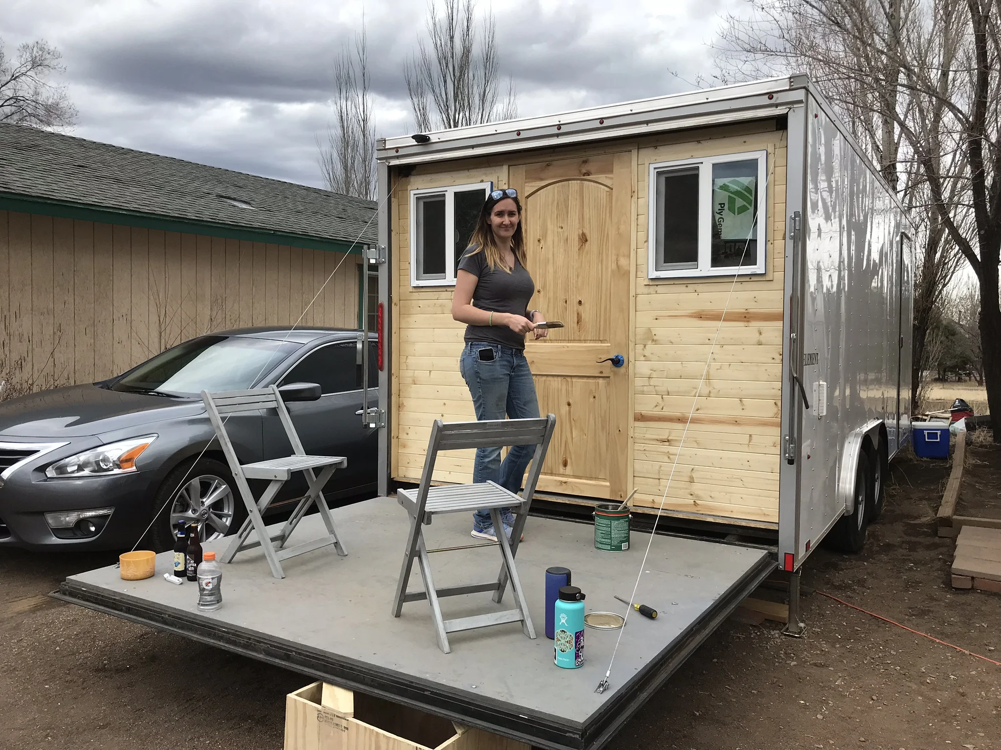 This is how our deck was intended. Tiffany is varnishing the exterior so it will hold up to the weather and sun. 