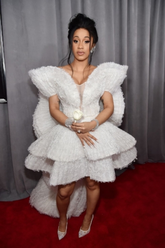 Cardi B wore a unique Ashi Studio dress. She definitely did not go unnoticed at her first Grammy’s show.