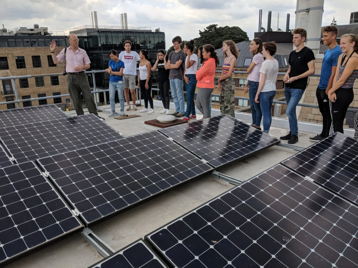 Inspecting the solar panels on the roof of the School of Geography and the Environment at Oxford University