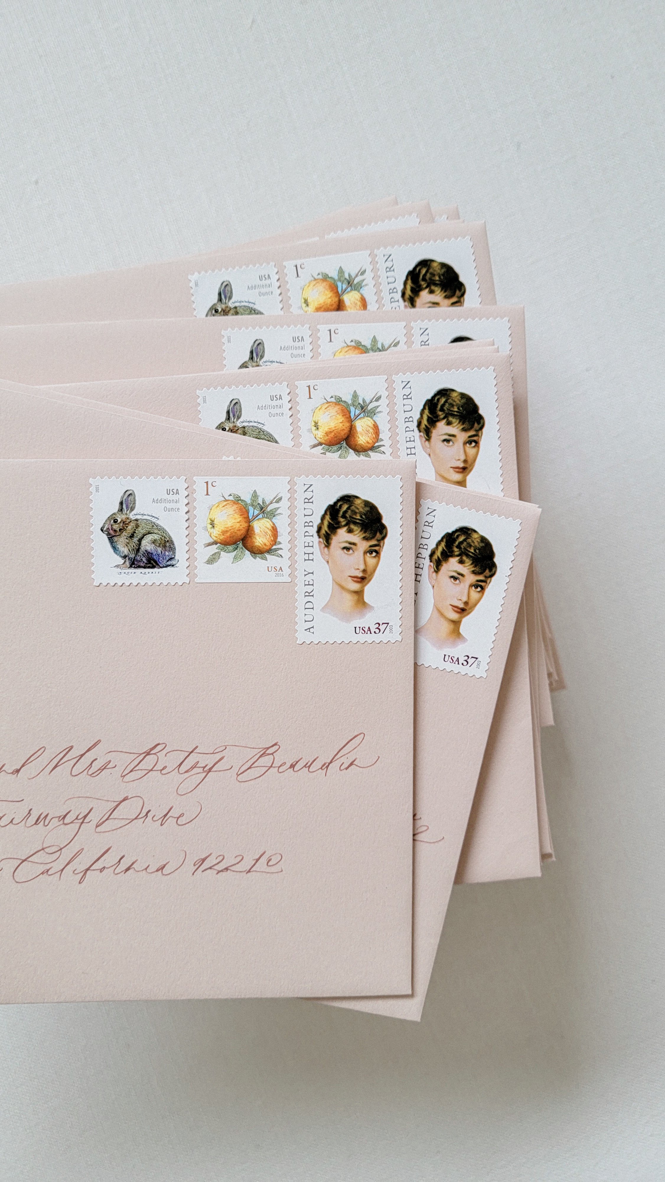 Wedding invitation envelopes with guest addresses in calligraphy and custom vintage stamp sets | Krisanna Elizabeth Co.jpg