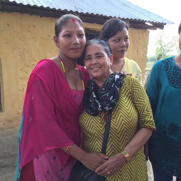 Shanta with two women in the community