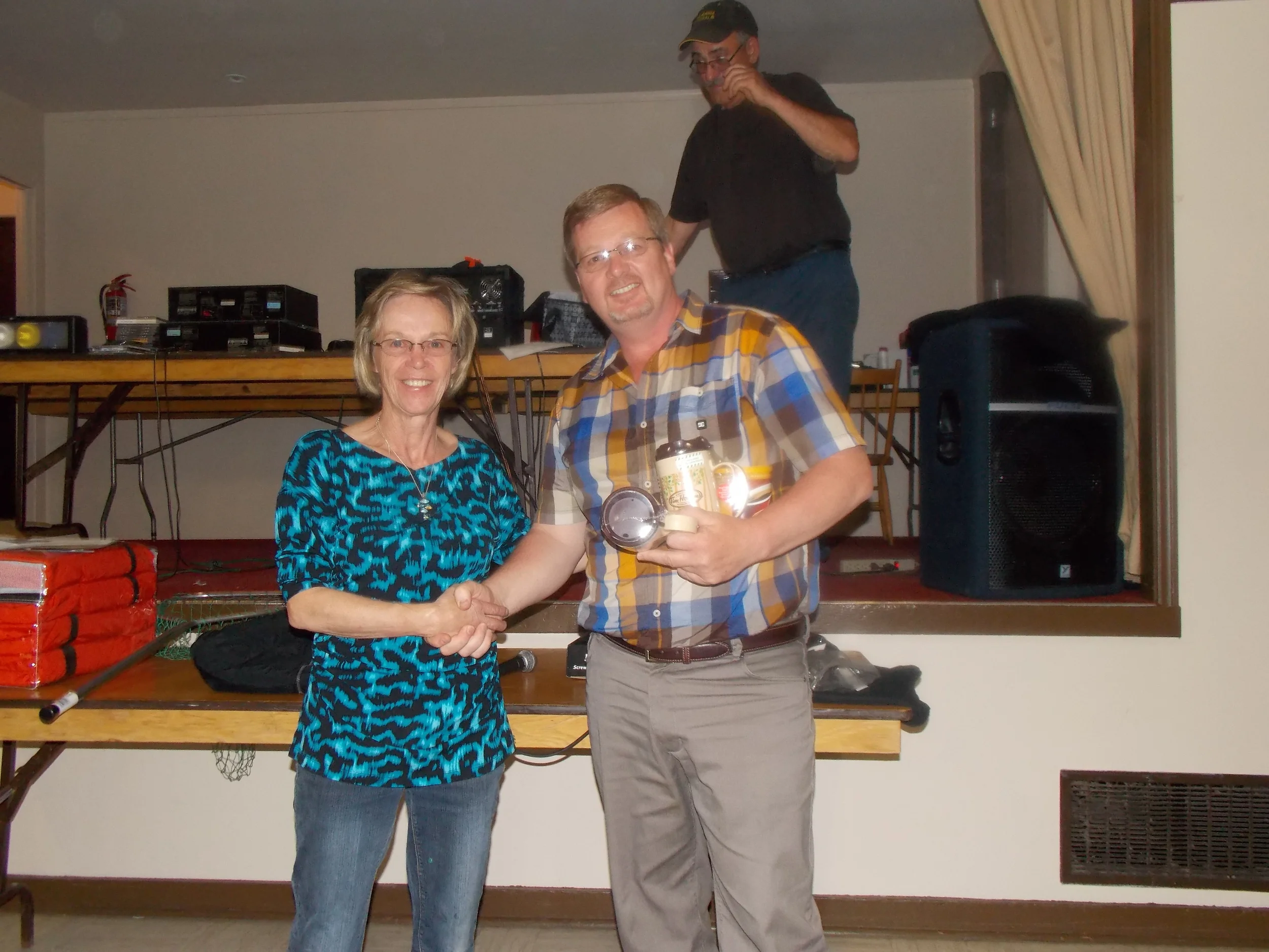 Ron Hicks Accepting a prize.jpg