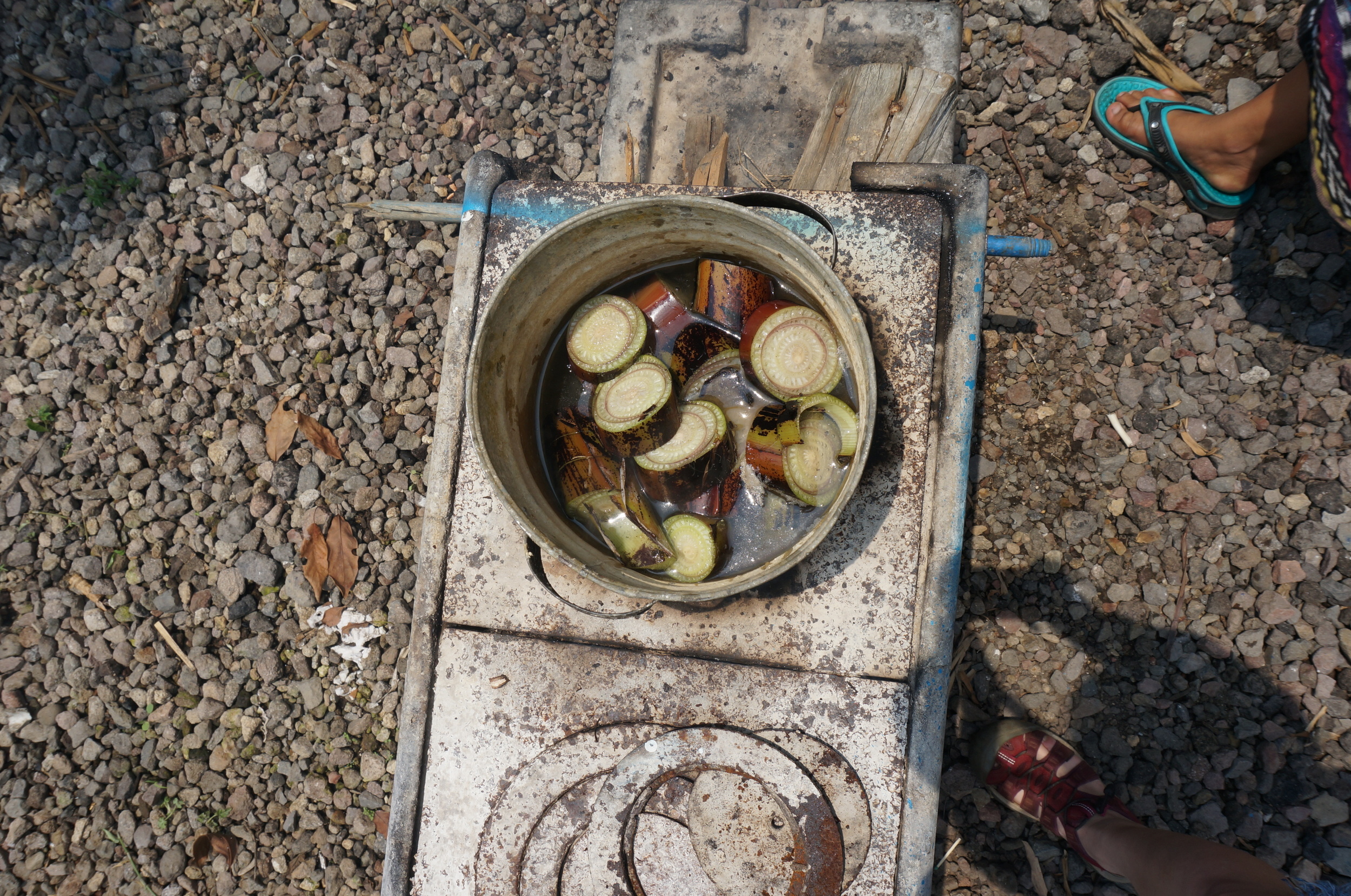 Banana tree trunk is boiled in water to help set the dye.