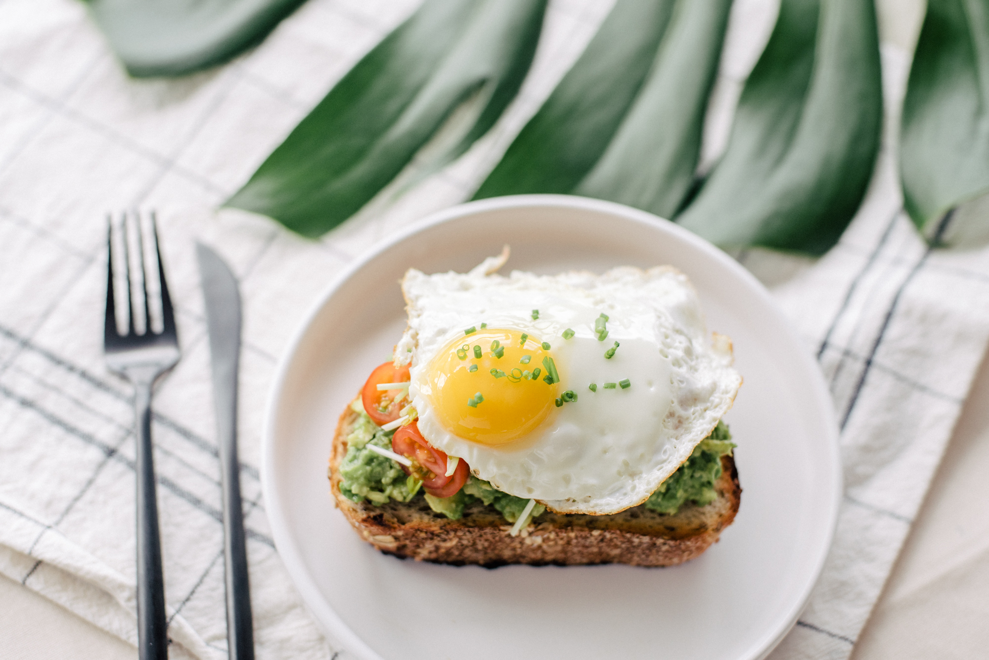 Avocado Toast topped with Sunny-side Up Egg