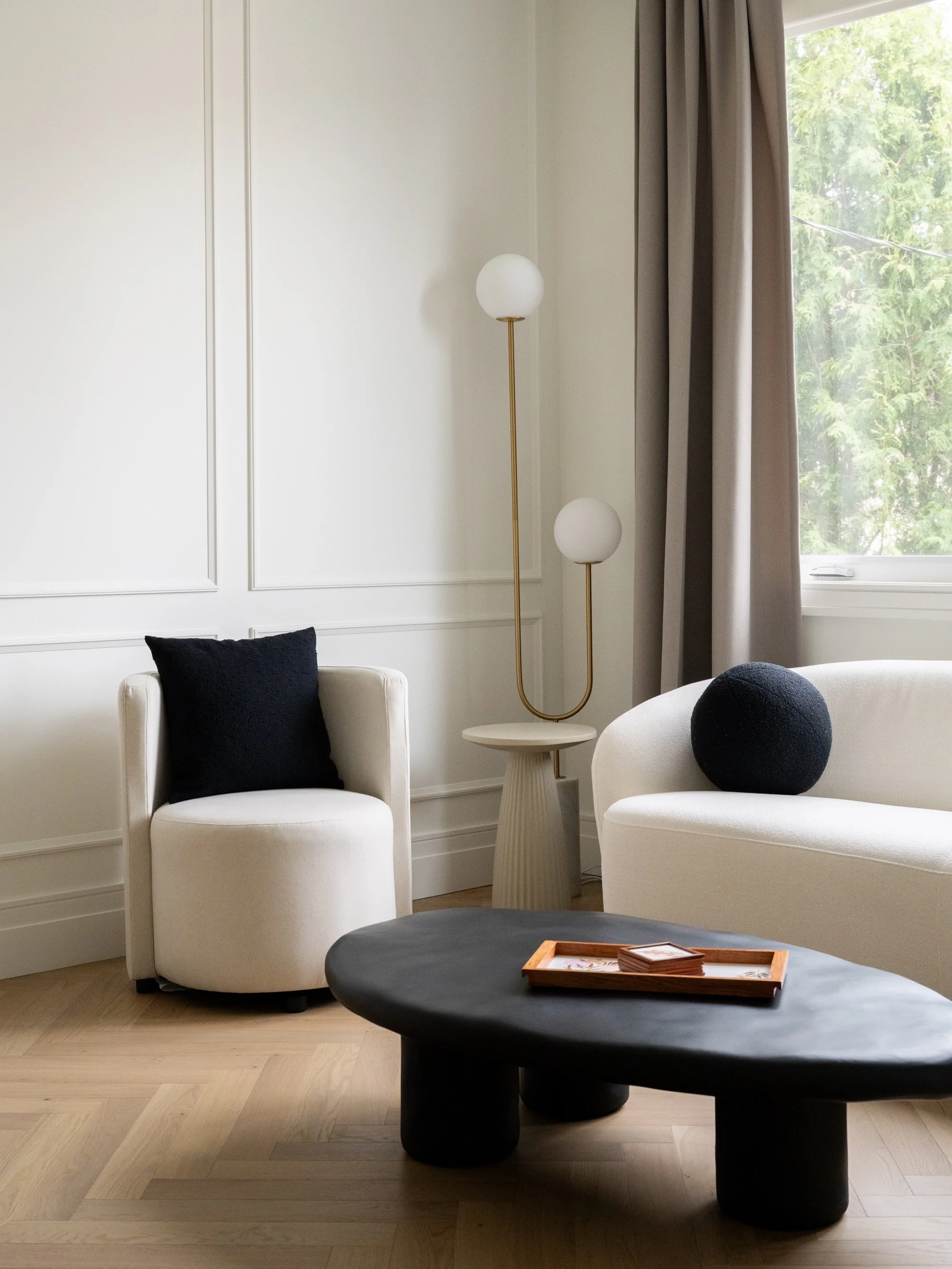 How I see a space as an interior photographer:

Photo 1 - Capture the corner. Corners can be interesting because of how the walls guide your eye.

Photo 2 - From afar with elements in between you and the subject

Photo 3 and 4 - Full view of the room
