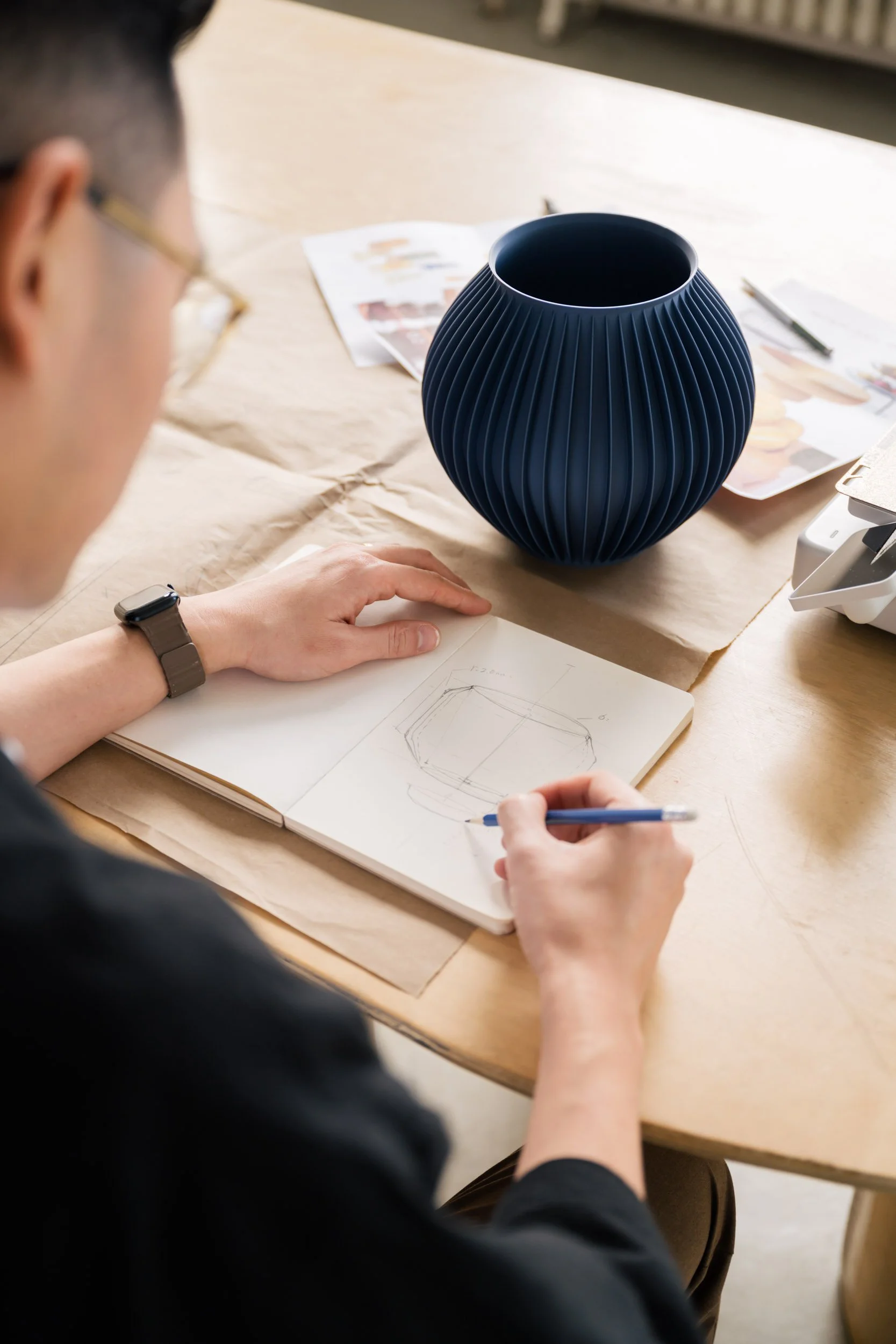 One of the Sonnihaus founders sketching one of their designs