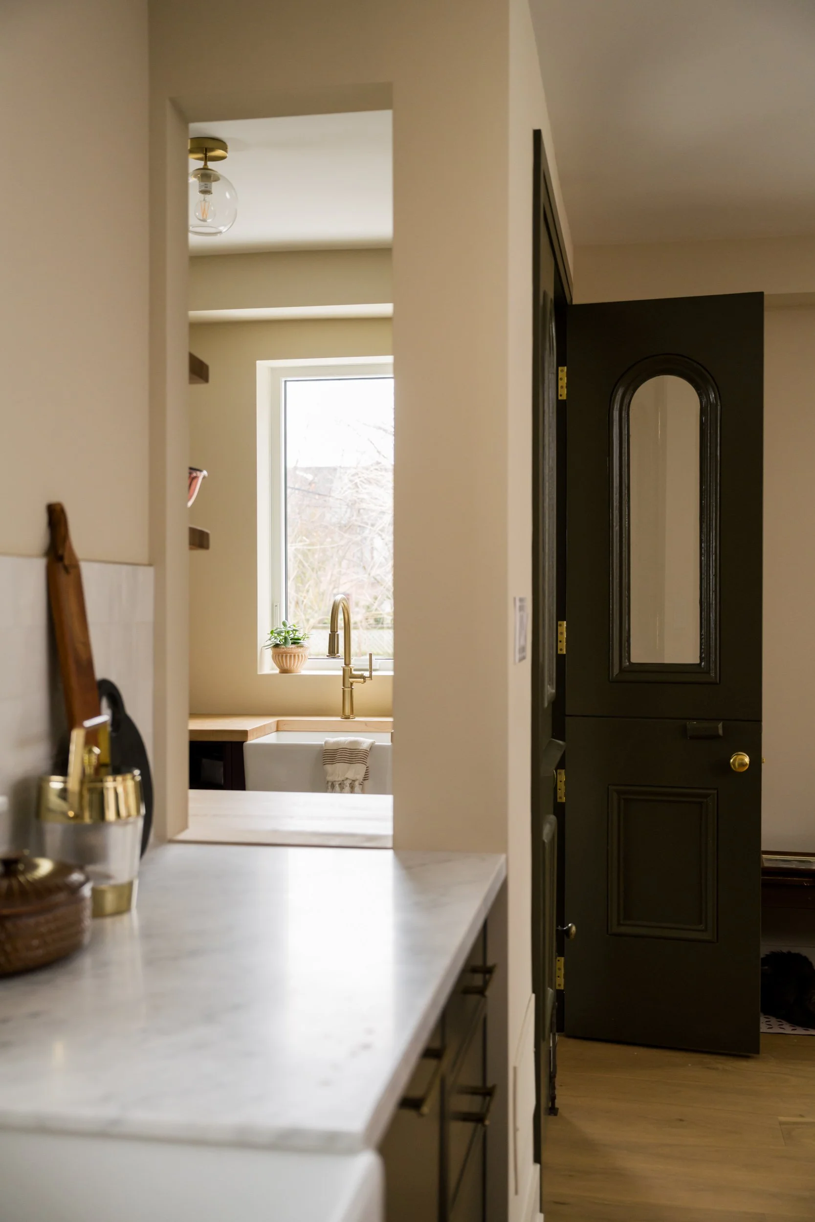 Pass-through window from kitchen to pantry