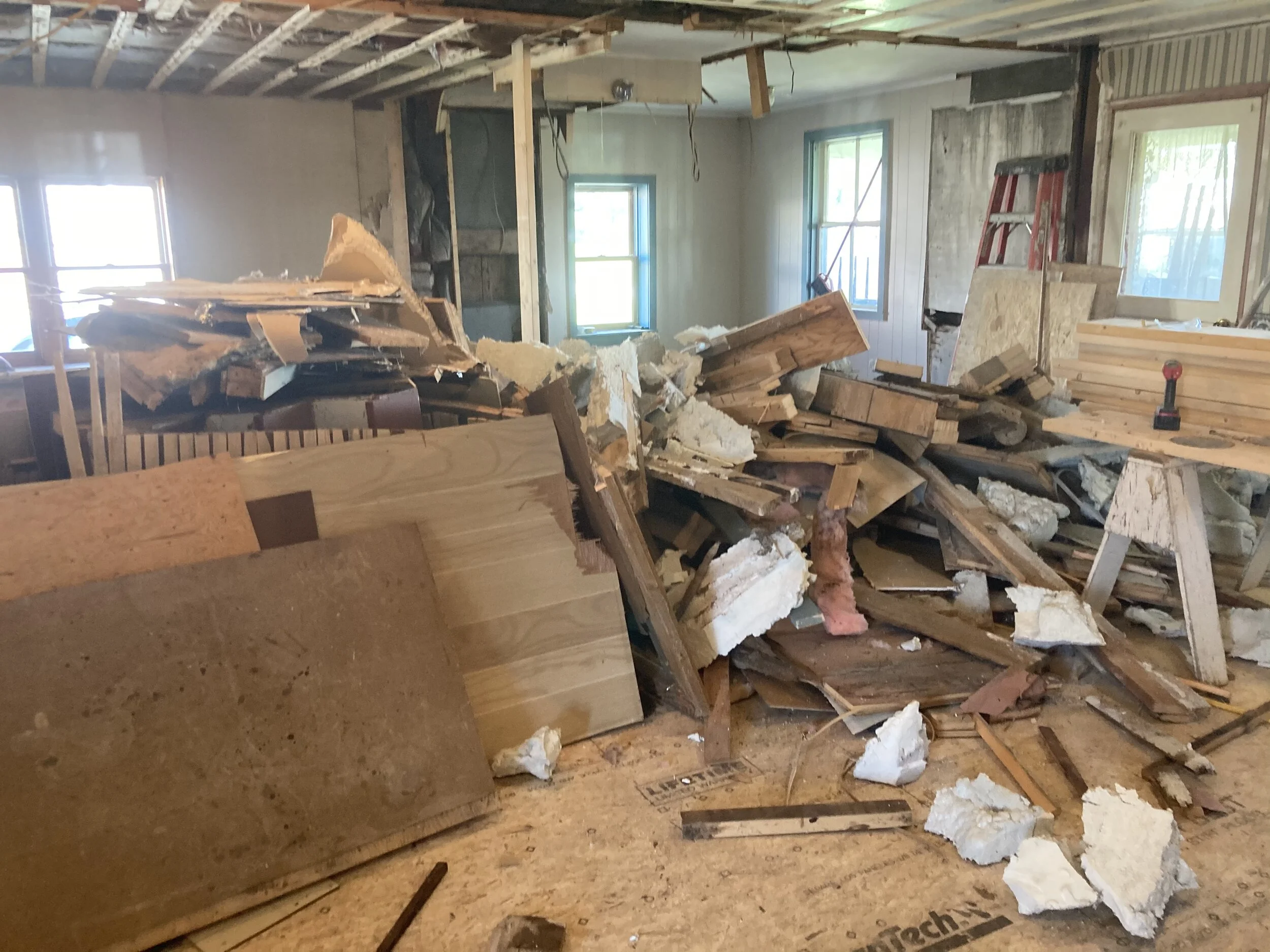  This beautiful stone home had fallen into disrepair and need major renovation. Beginning demolition and professional asbestos abatement. 