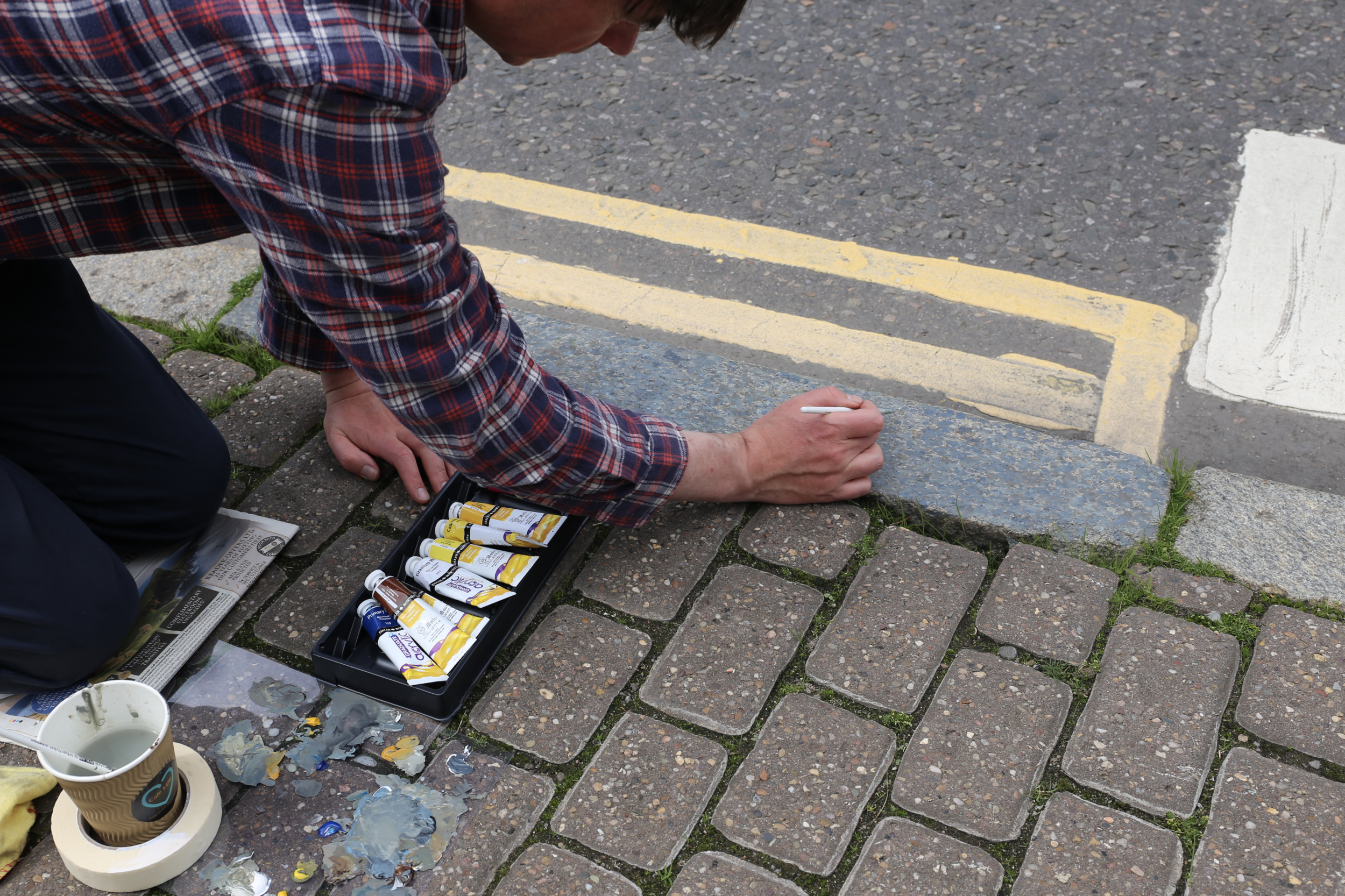 David Sherry’s performance Painting a Curb Stone in the Same Colour as a Curb Stone Courtesy David Sherry