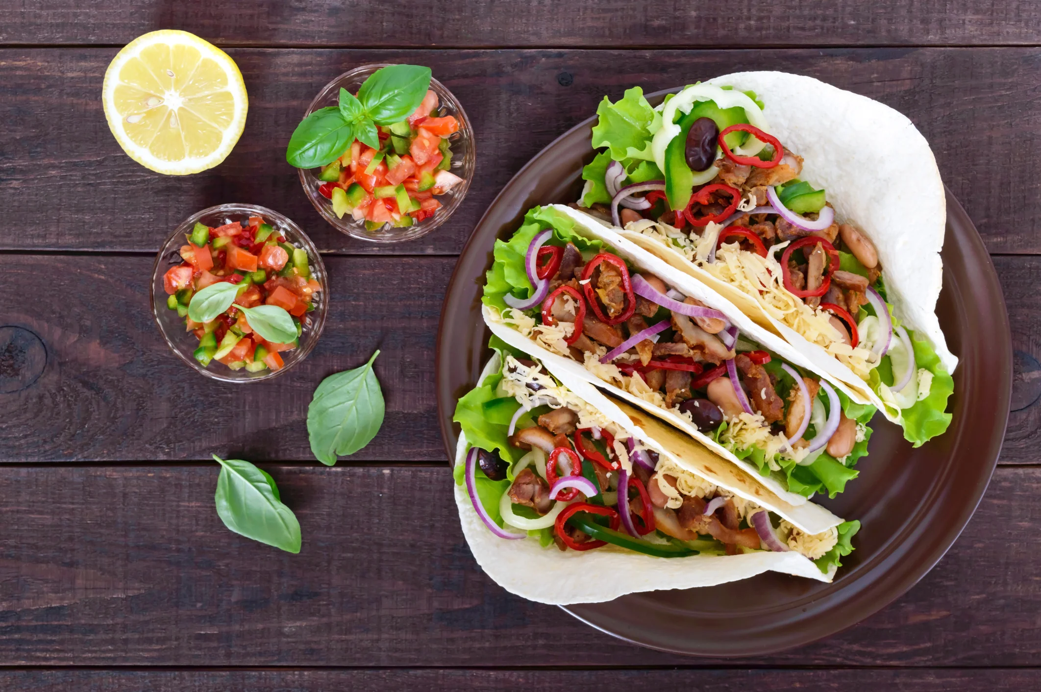 Spicy Fish Tacos with Creamy Lime Guacamole and Cabbage Slaw