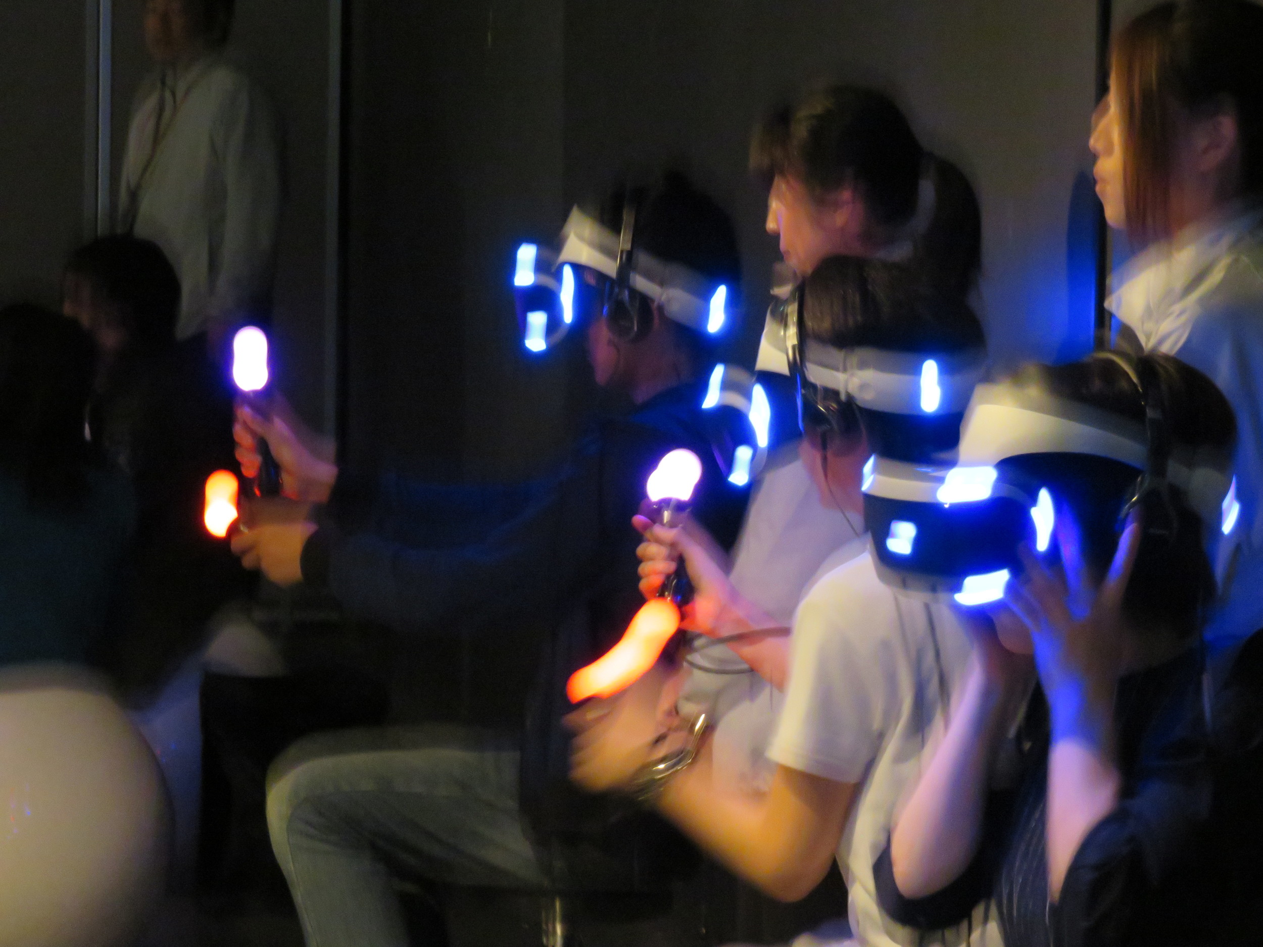 A glimpse of the future, with attendants: VR headsets and handsets in action