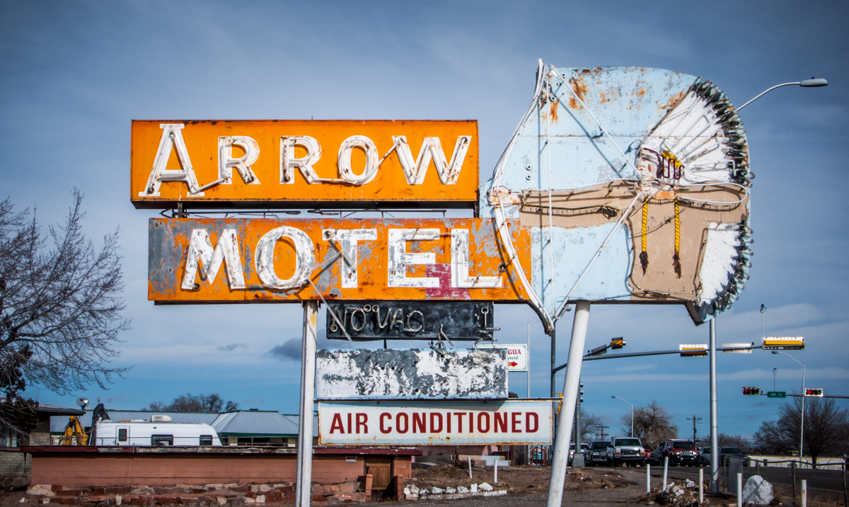 The Arrow Motel, in Española, NM, was still standing as of late 2016, but the doors to the rooms were replaced with plywood long ago.