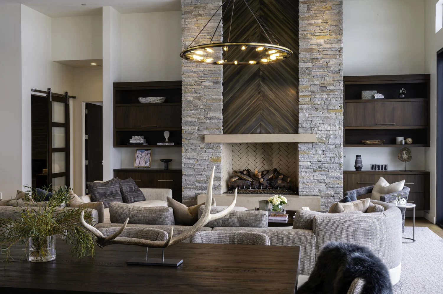 Living room with stacked stone fireplace