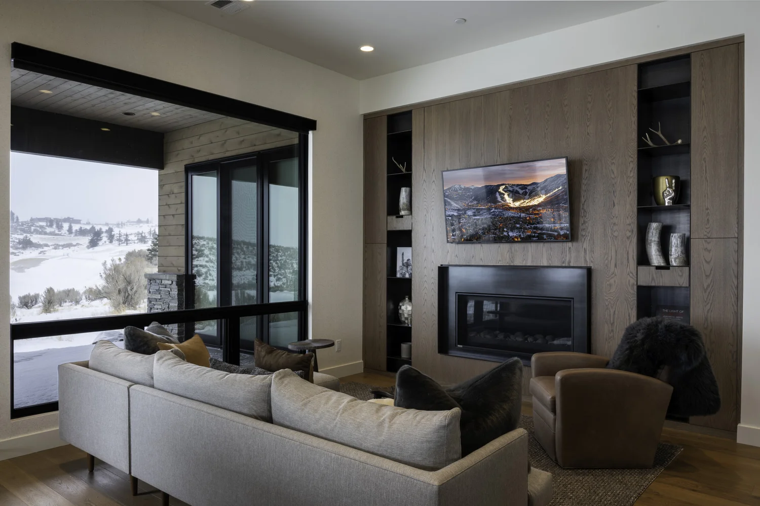 Living room looking out to a snowy mountain view
