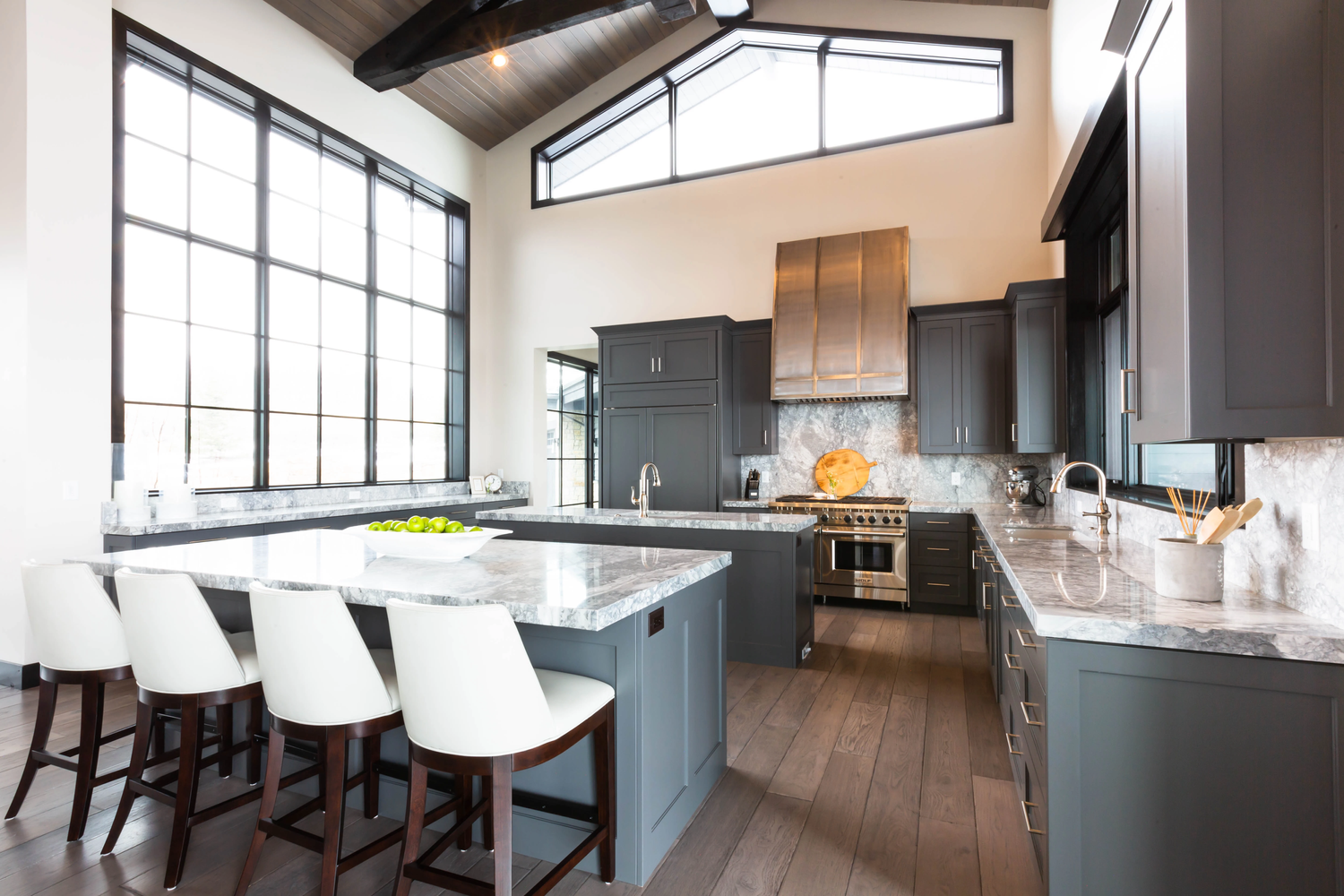 Kitchen with dark cabinetry and clerestory windows