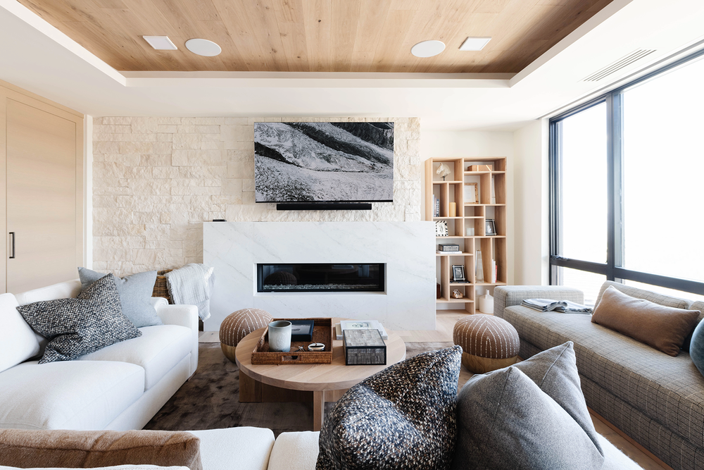 Living room with wood ceiling and fireplace