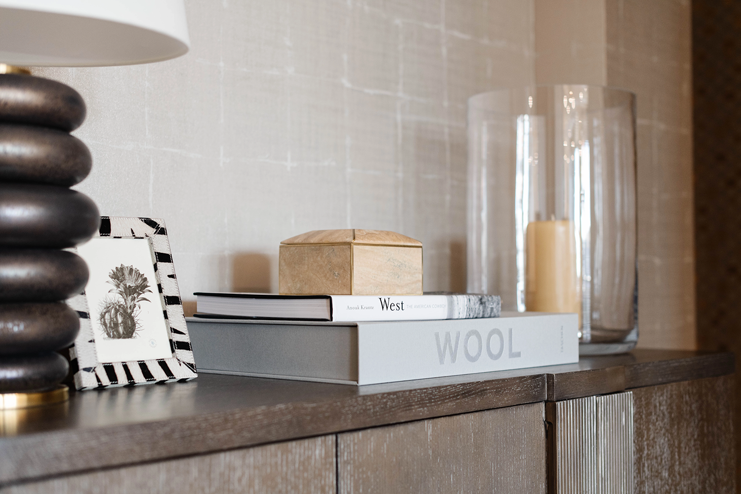 Styled detail of books and objects on a wood surface