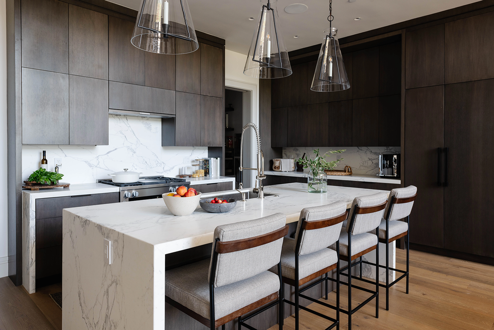 Kitchen island with dark wood cabinetry