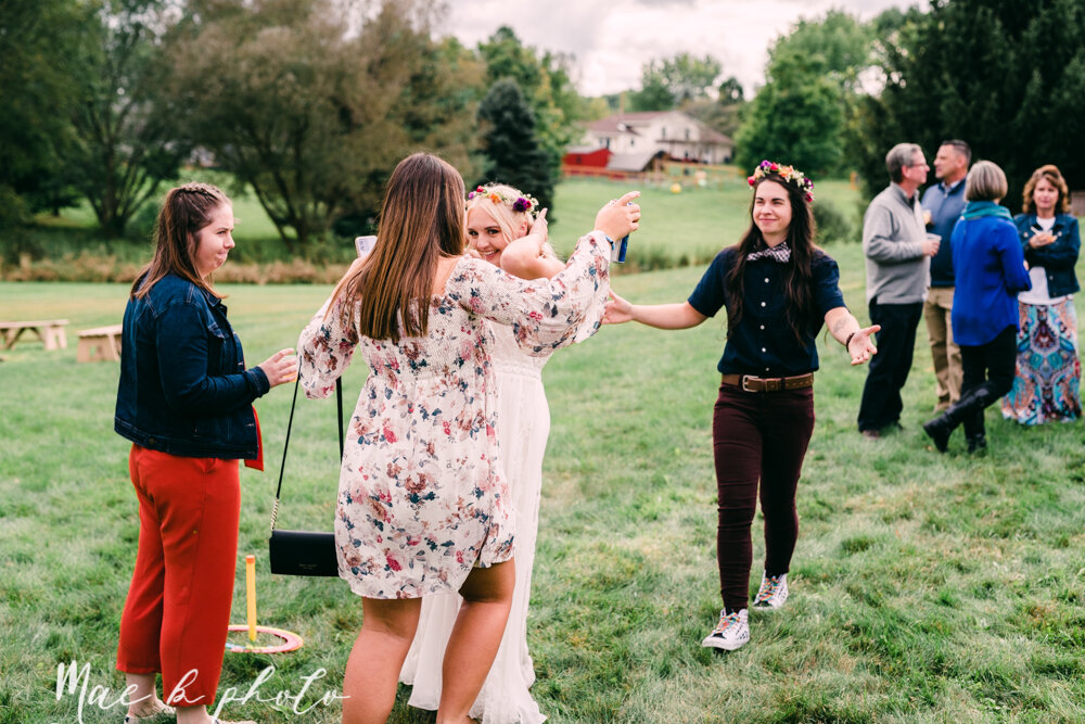 allie and nickie's colorful summer backyard pride wedding in kent ohio photographed by youngstown lgbtq wedding photographer mae b photo-130.jpg