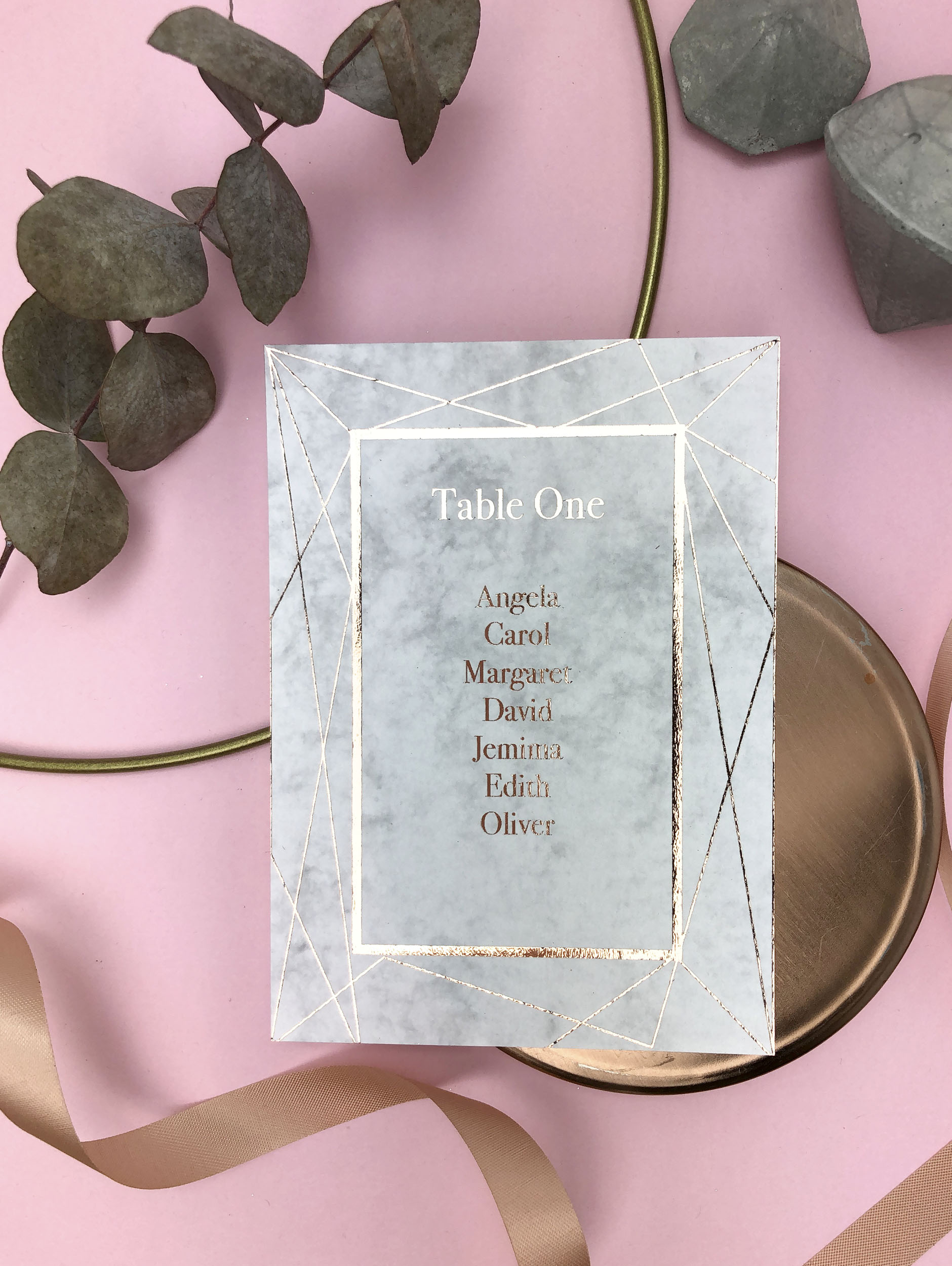 marble and rose gold table plan cards