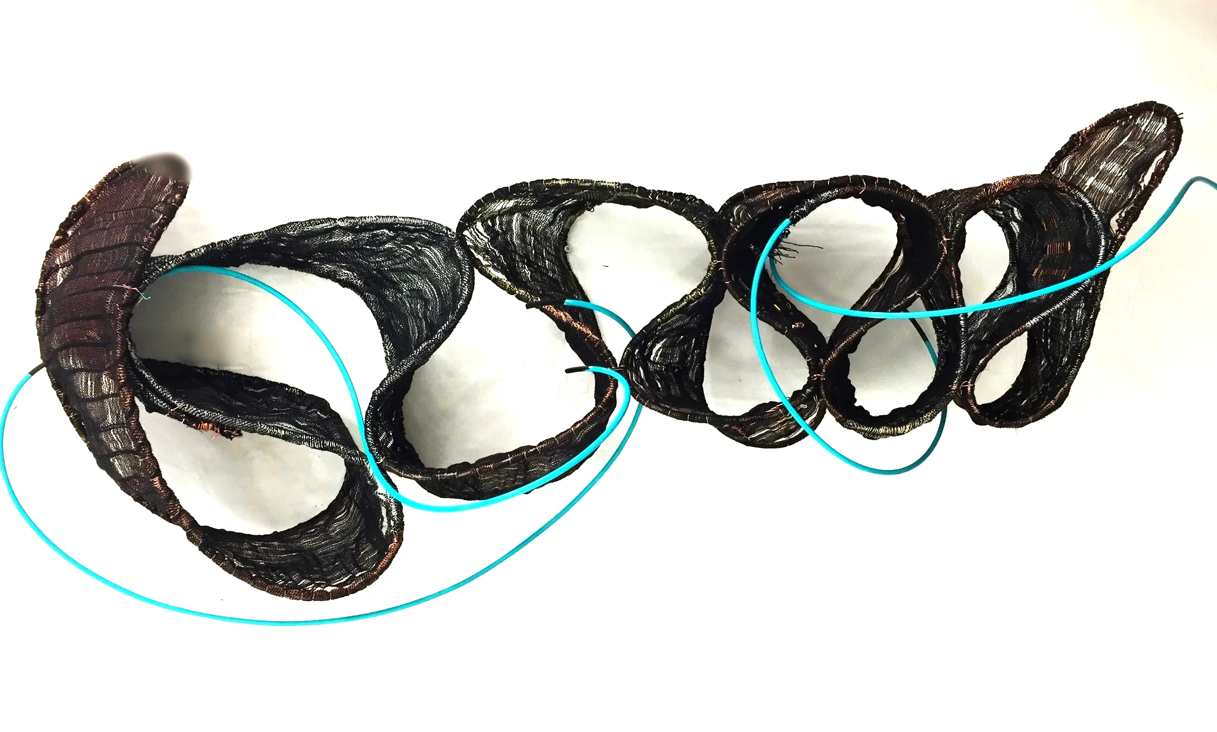 Woven steel, brass, copper, acrylic paint, tubing and cotton