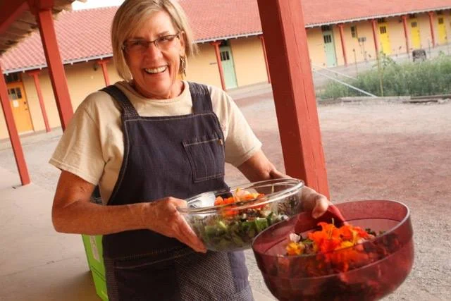 Serving salads made from produce grown on-site in the Many Hands Urban Farm