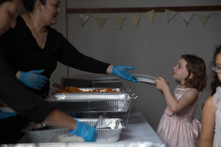 Caterer Dionne Vega serving Chile en Nogada at a Conference Center wedding