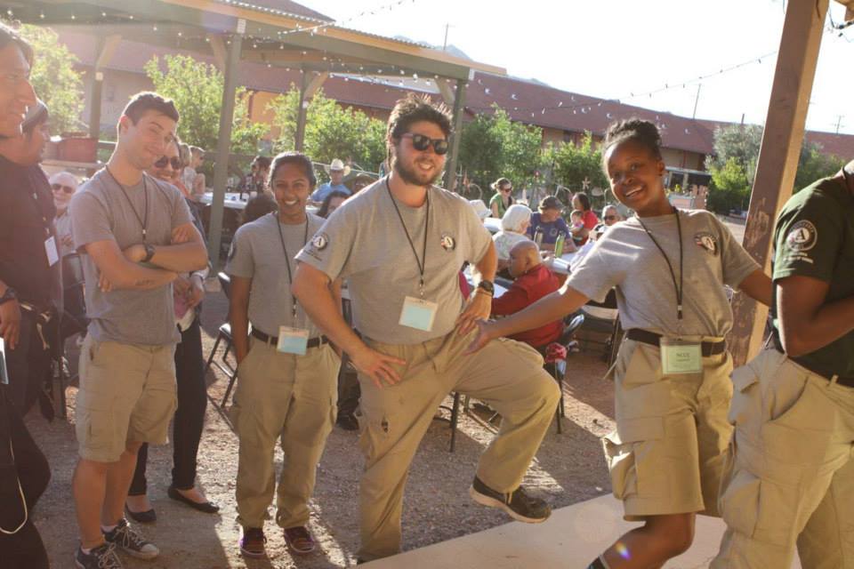 A group of Americorps crew members at a dinner in our courtyard during the 2015 Community Arts Gathering