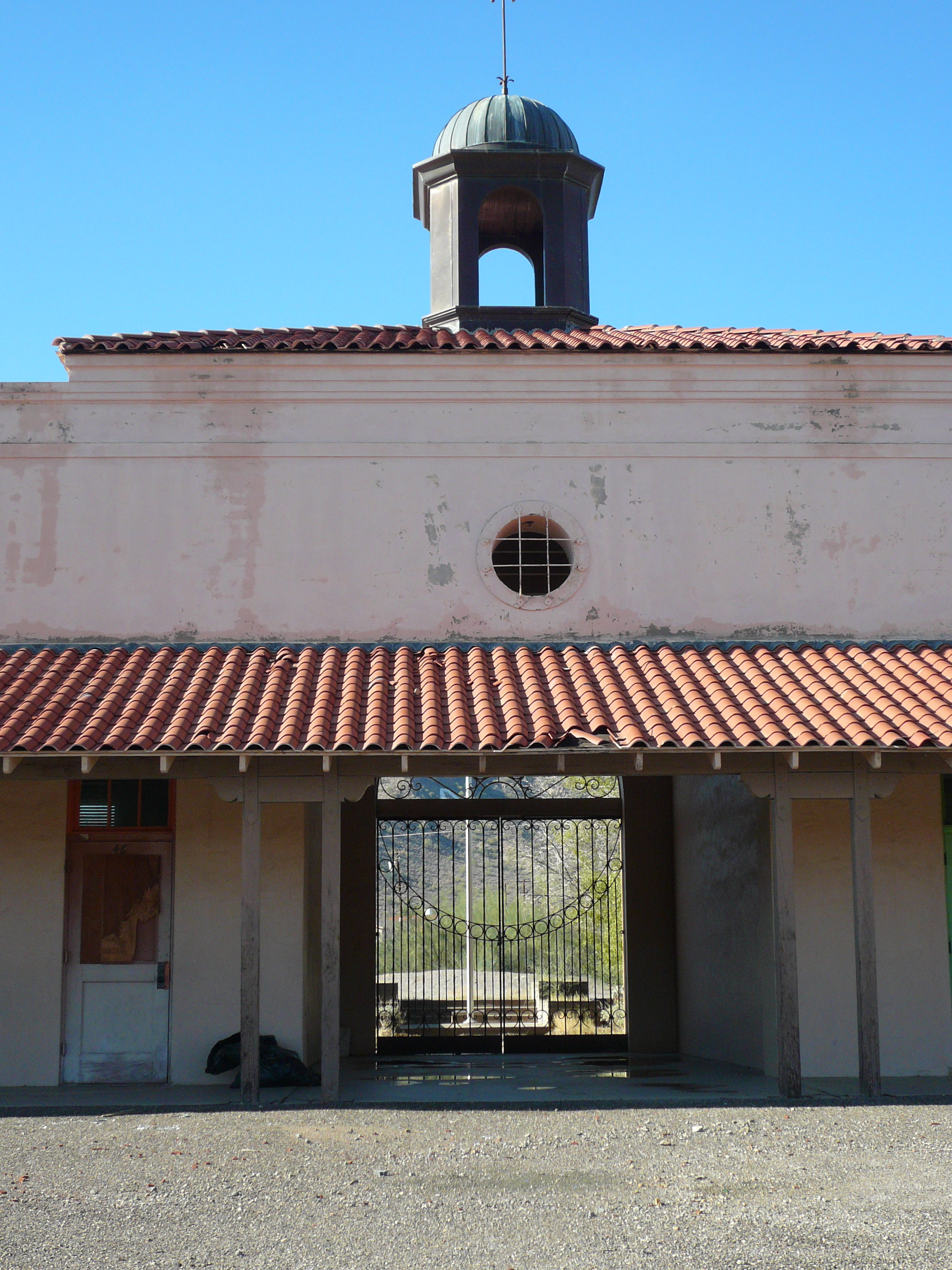 The main entrance before renovations. The stucco walls and tile roofs were all restored.