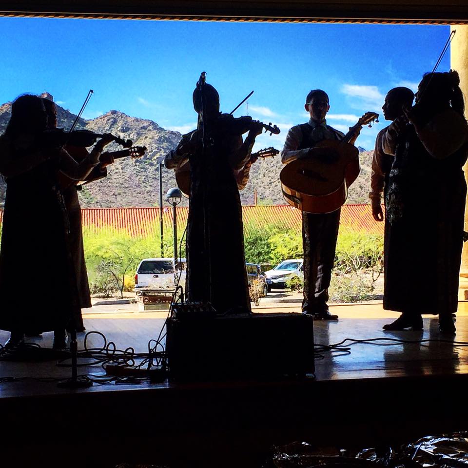  A mariachi band performing in the Curley School Auditorium, with a view of A Mountain behind them. The Auditorium features a retractable wall with beautiful views! 