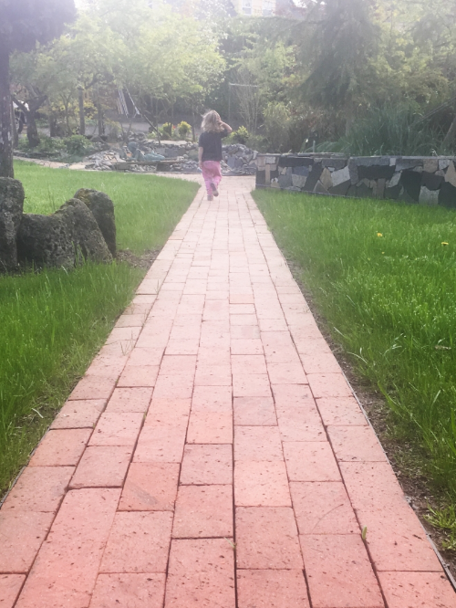 Stella running down the brick path at Baba & Papa's House this weekend.