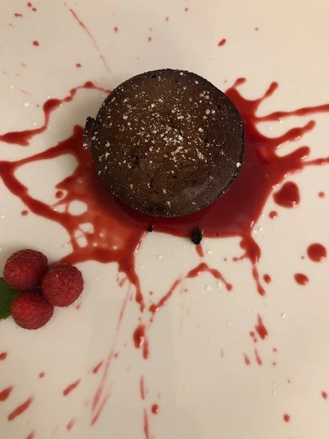 Chocolate lava cake with raspberry compote.