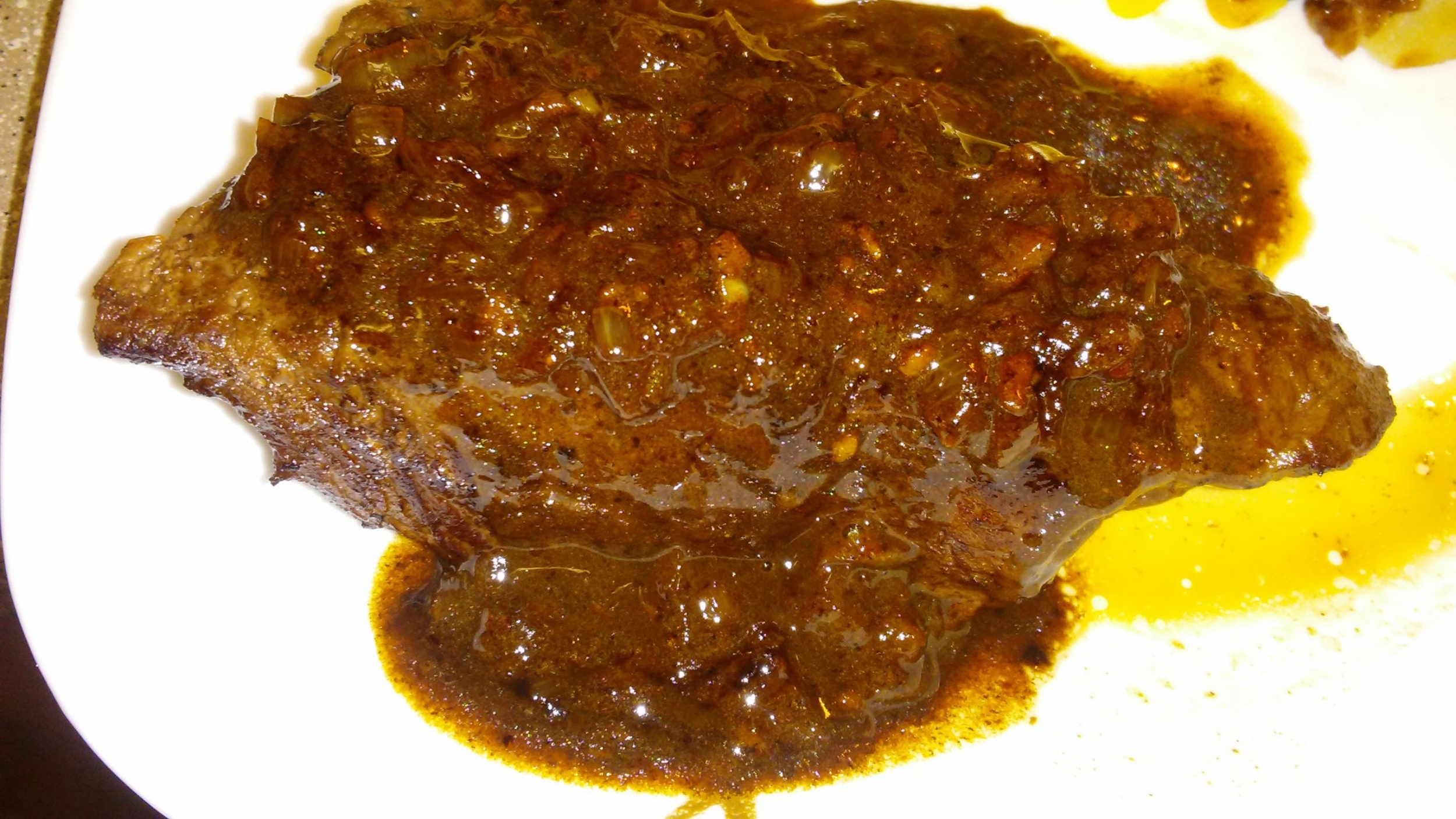 Yummy, tender steak with a savory sauce