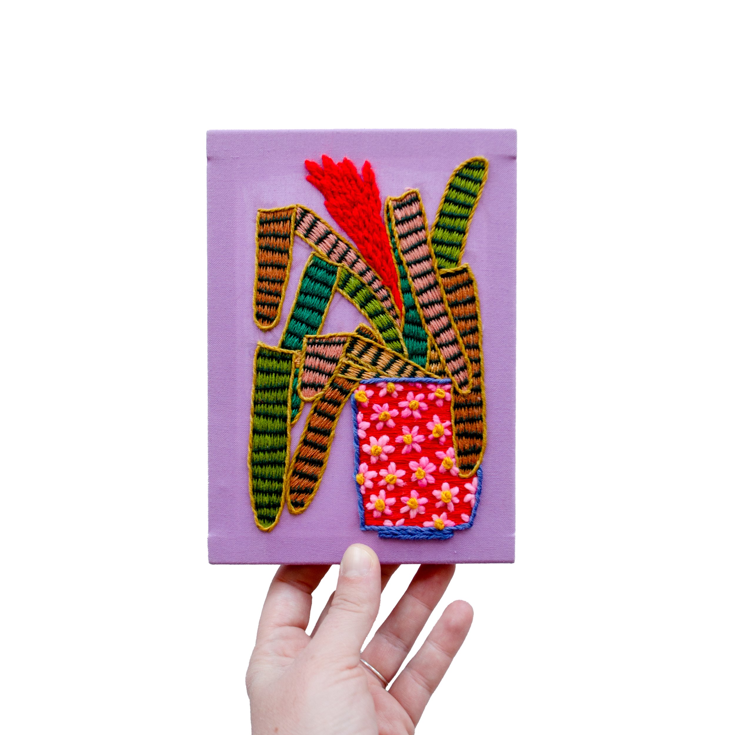 imaginary plant on lilac with hand.png