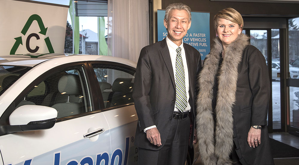 KC Tran, CEO and Co-Founder of CRI and Ragnheidur Elin Arnadottir Minister of Industry and Commerce of Iceland, with the Geely Emgrand EC7 methanol vehicle.