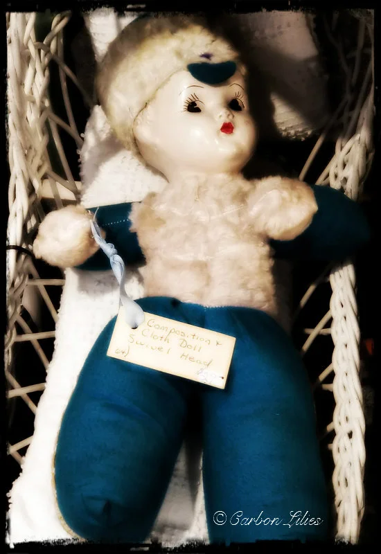 Though John hates dolls, this one kept calling her back & she had to take a photo.