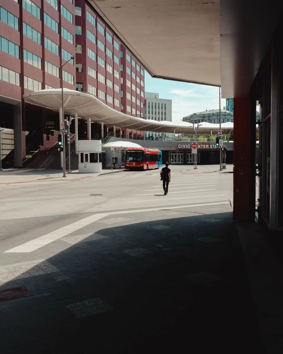 Denver man crosses street.