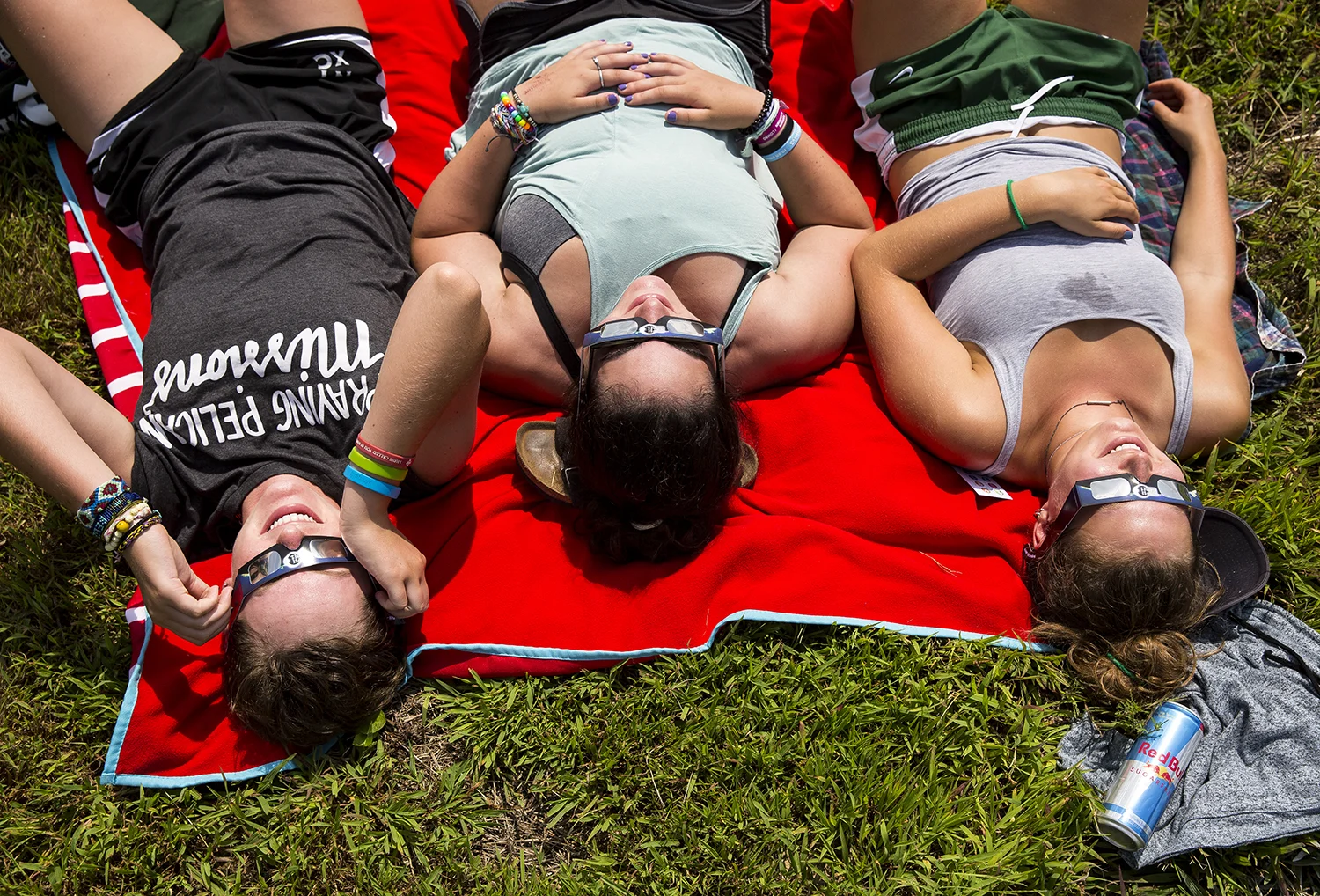 Amanda Stiffler, left, Becca Solot and Caroline Lesniak, from Chicago, watch the solar eclipse at Giant City State Park near Carbondale. “Everyone around was just like freaking out together," said Stiffler, describing the moments of totality.