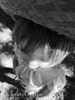 the focus is the child . her hair . her eyelashes .