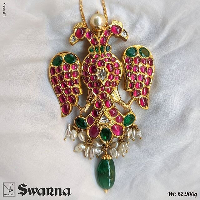 Royal Gandaberunda Pendent...studded with Cob ruby &amp; emerald.. with tiny pearl tassels..
Shop online @ /shop.gujjadi.com/
#gold #pendant #coral #pearl #GSB #gandaberunda #mysuru #royalpendents #royal #grandeur #southindianjewelry #weddingjewelry 