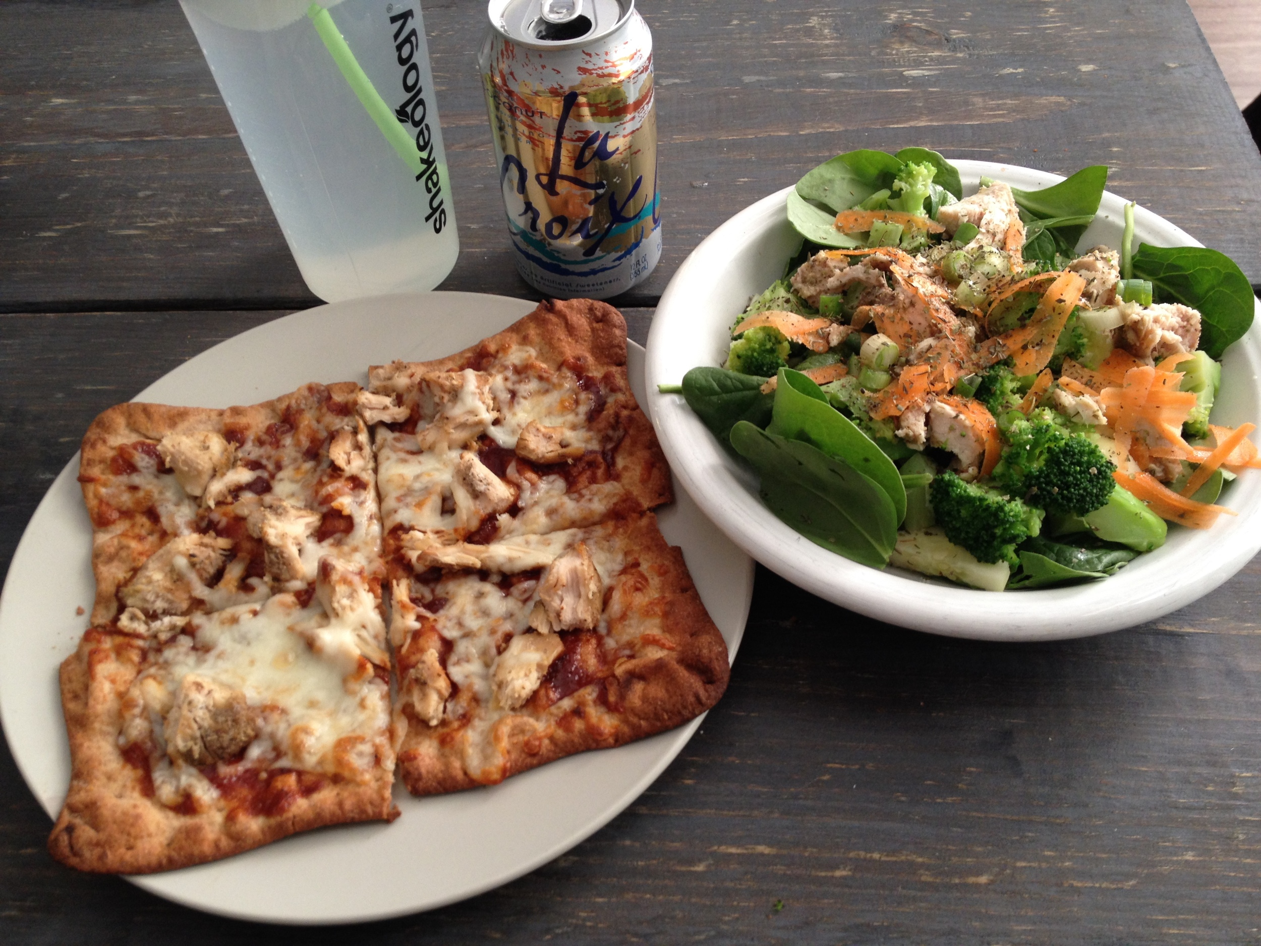 Pizza is one of the main food groups, right? Pizza, water in a Shakeology bottle, La Croix, and vegetable medley salad. Yum.