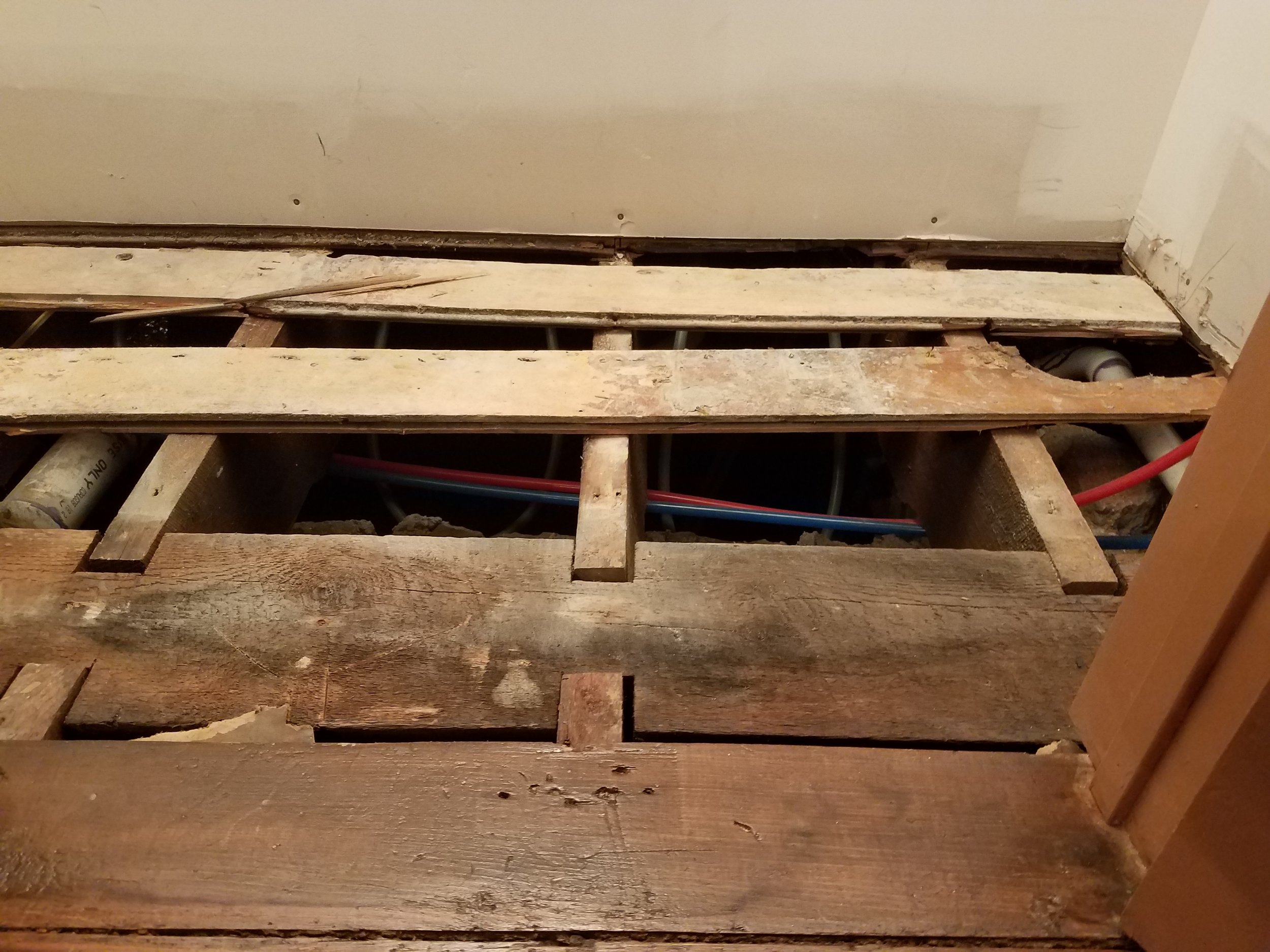Since we planned on a marble floor, we removed the old flooring so that the thicker marble would be level with the rest of the house. This revealed the 12x12 inch center beam of the house. They didn't have iron I beams in 1870!. 