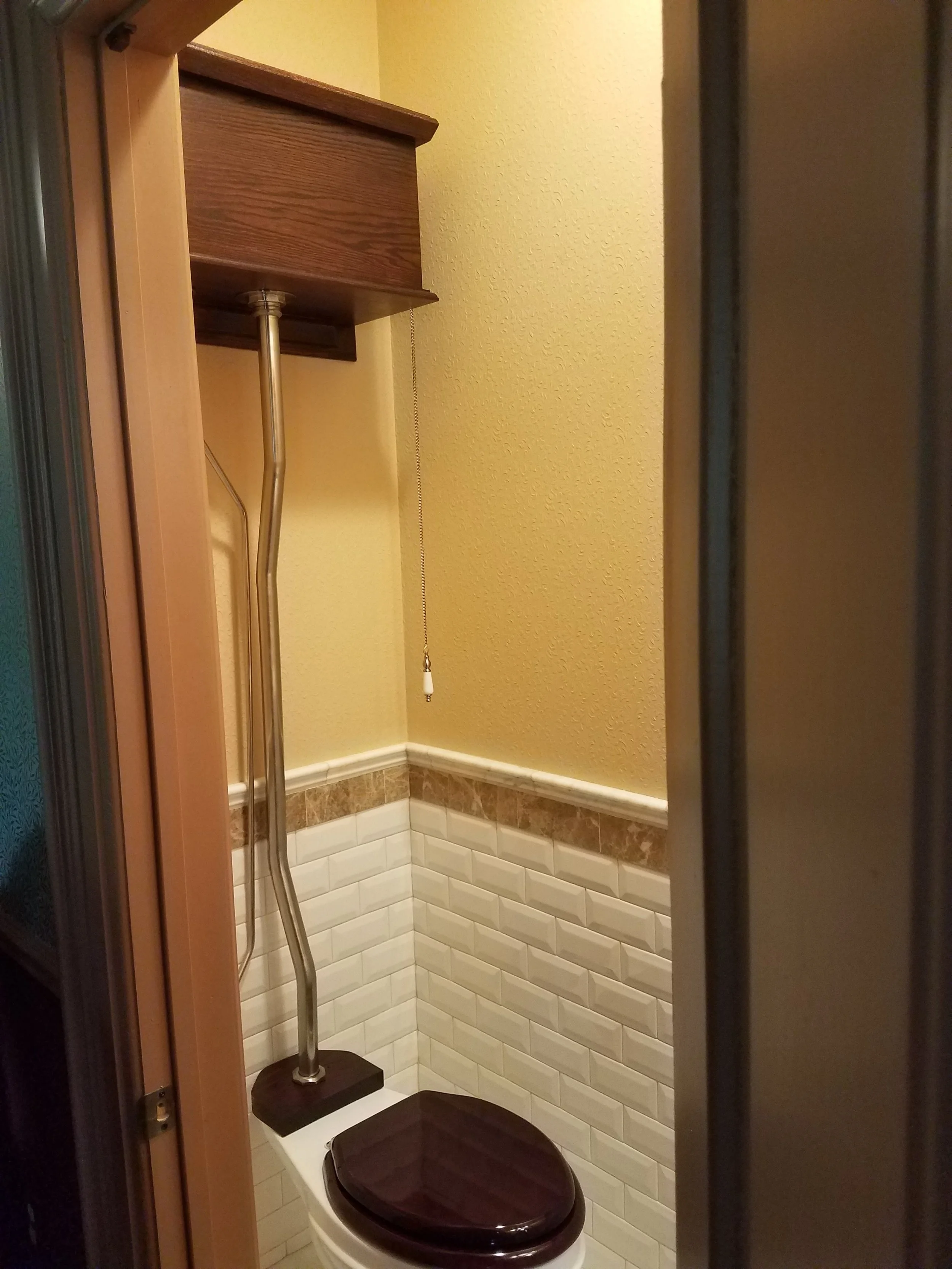 High back pull chain toilet.