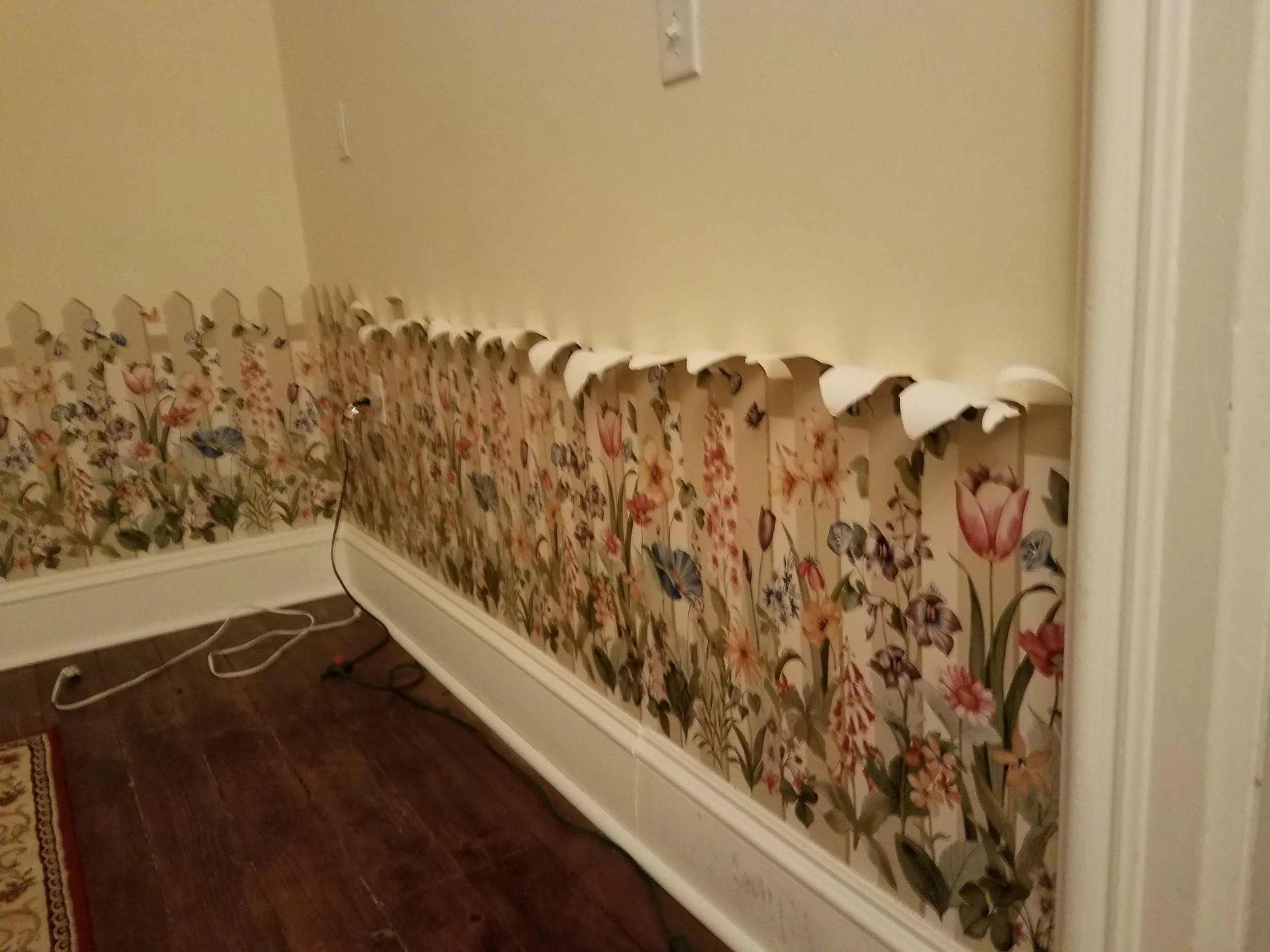 Down comes the flowery fence!